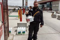 That ain't tee in there. That's how we fill our gas tanks here in Xinjiang.