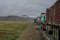 Standing trucks on a mountain road, hours of waiting ahead