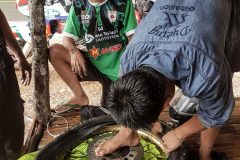 Lao Kids know how to fixe tyres. They don't need tyre levers, all they use is theri hands and feet. Impressive. Near Pak Mong